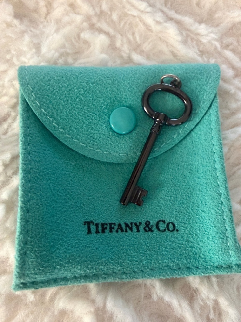 Tiffany & Co. Blue-Green Velvet Pouch with Gunmetal Key Charm